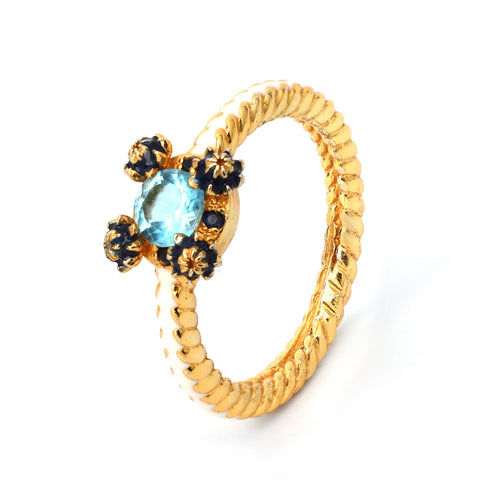 Gold rope ring with blue topaz and sapphire floral accents, handcrafted gemstone jewelry