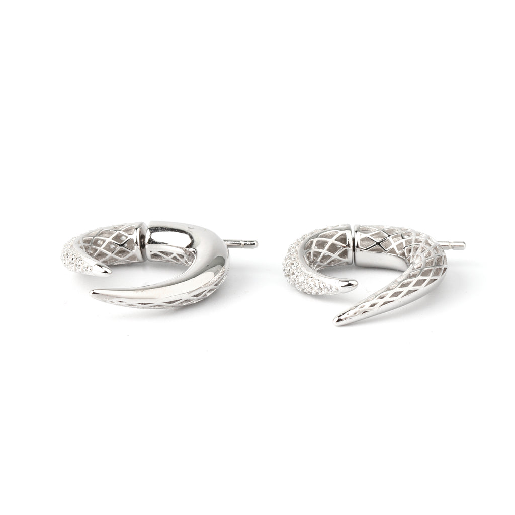 Detail shot of pavé-style texture and sculpted curve on sterling silver earrings
