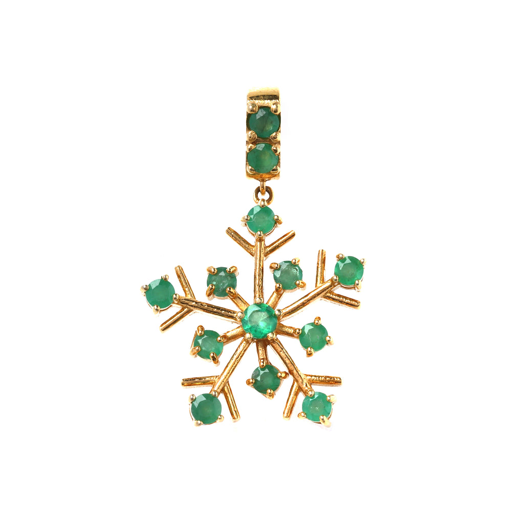 Close-up of emerald snowflake pendant in 925 sterling silver with gold finish by Jewelry by Crimson