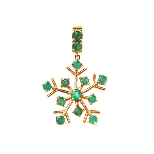 Close-up of emerald snowflake pendant in 925 sterling silver with gold finish by Jewelry by Crimson