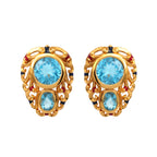 Gold-tone filigree earrings with blue topaz and red/blue accent stones, elegant gemstone jewelry