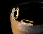 Sky-blue topaz gold hoop earrings — side view