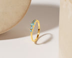 Sky-blue topaz gold stacking ring — front view