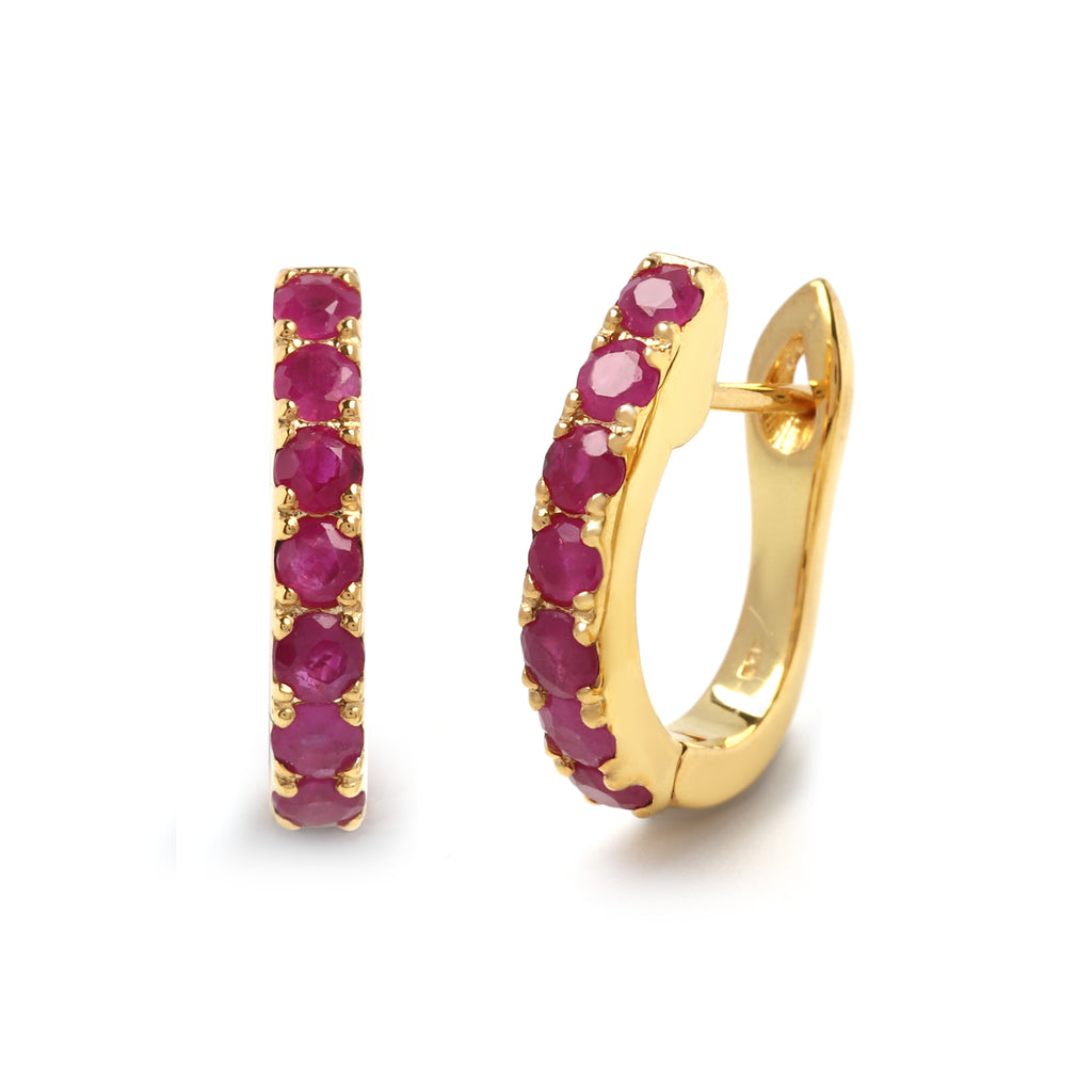 Close-up of ruby hoop earrings in 925 sterling silver with gold finish by Jewelry by Crimson