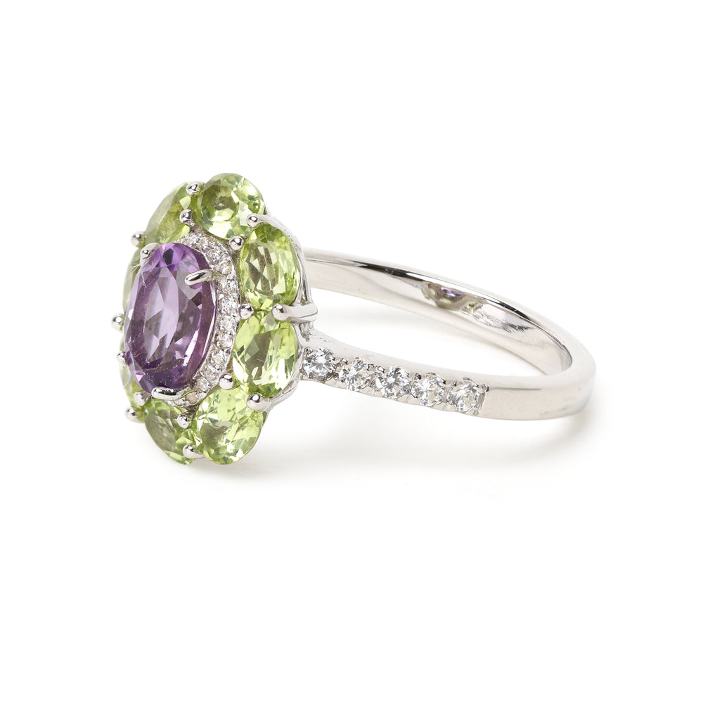 Oval amethyst gemstone ring with peridot floral cluster design