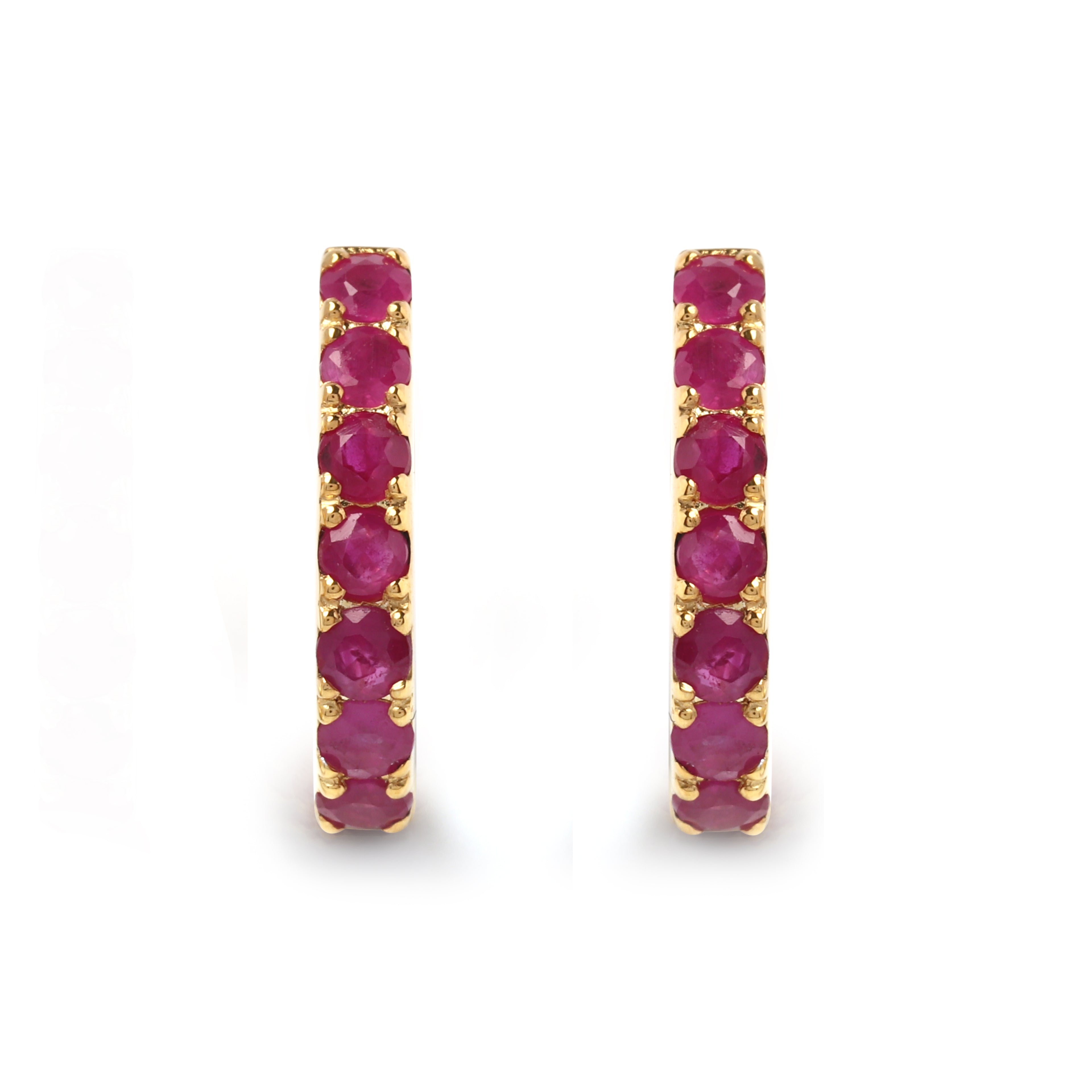 Detail of prong-set ruby stones on gold-finished 925 sterling silver hoop earrings