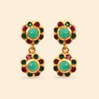 Gold-tone dangle earrings with green and red enamel flower design, featuring round green gemstone centers.