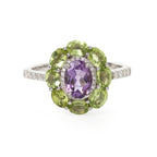 Oval amethyst center stone ring with peridot petals and diamond accents in sterling silver