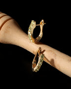 Gold huggie earrings with natural peridot — pair view