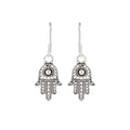 Close-up of Hamsa hand 925 sterling silver drop earrings with dotted detailing by Jewelry by Crimson