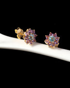 Blue topaz and amethyst flower stud earrings — display view