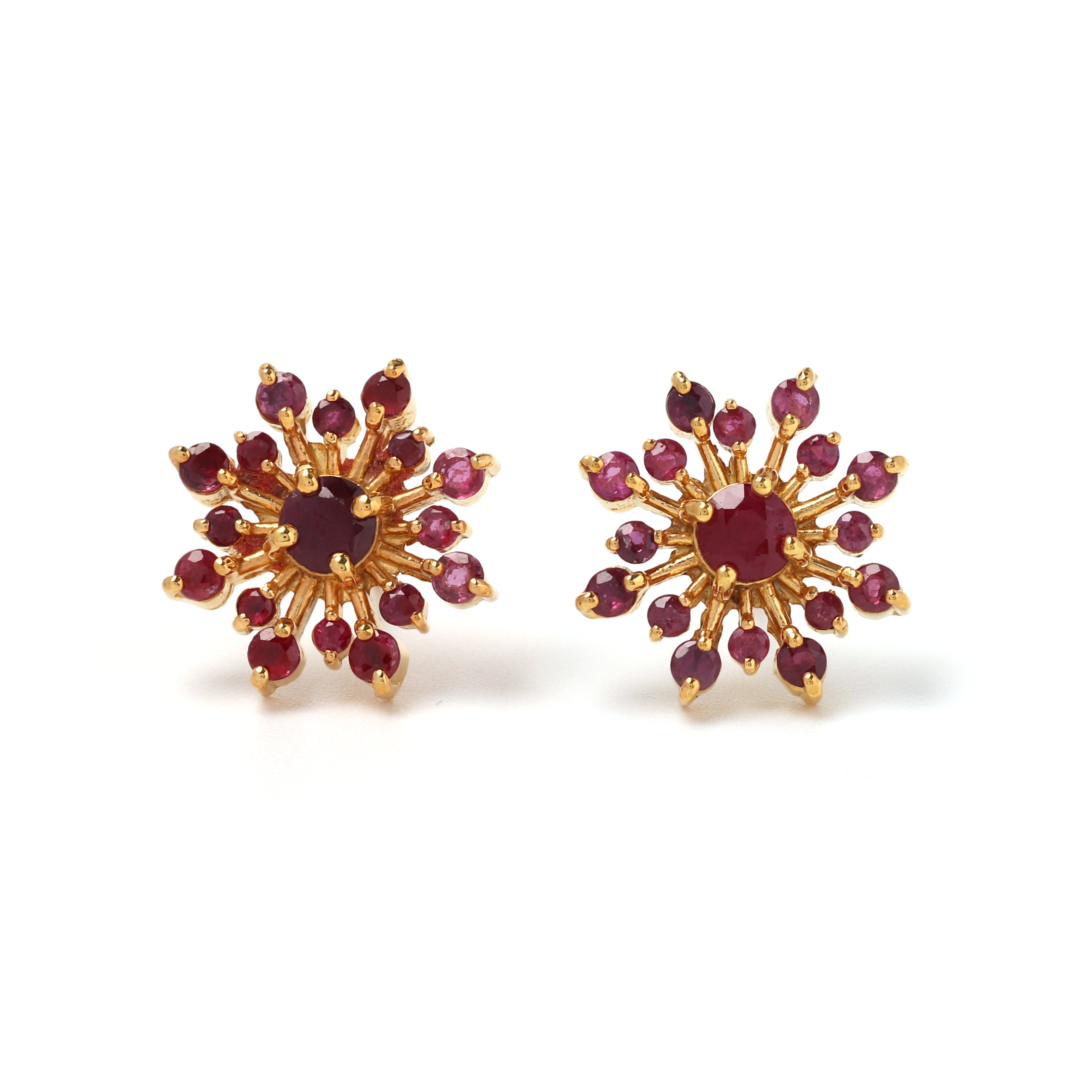 Close-up of ruby stud earrings in 925 sterling silver with gold finish by Jewelry by Crimson