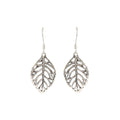 Close-up of leaf-shaped 925 sterling silver drop earrings with openwork veins by Jewelry by Crimson