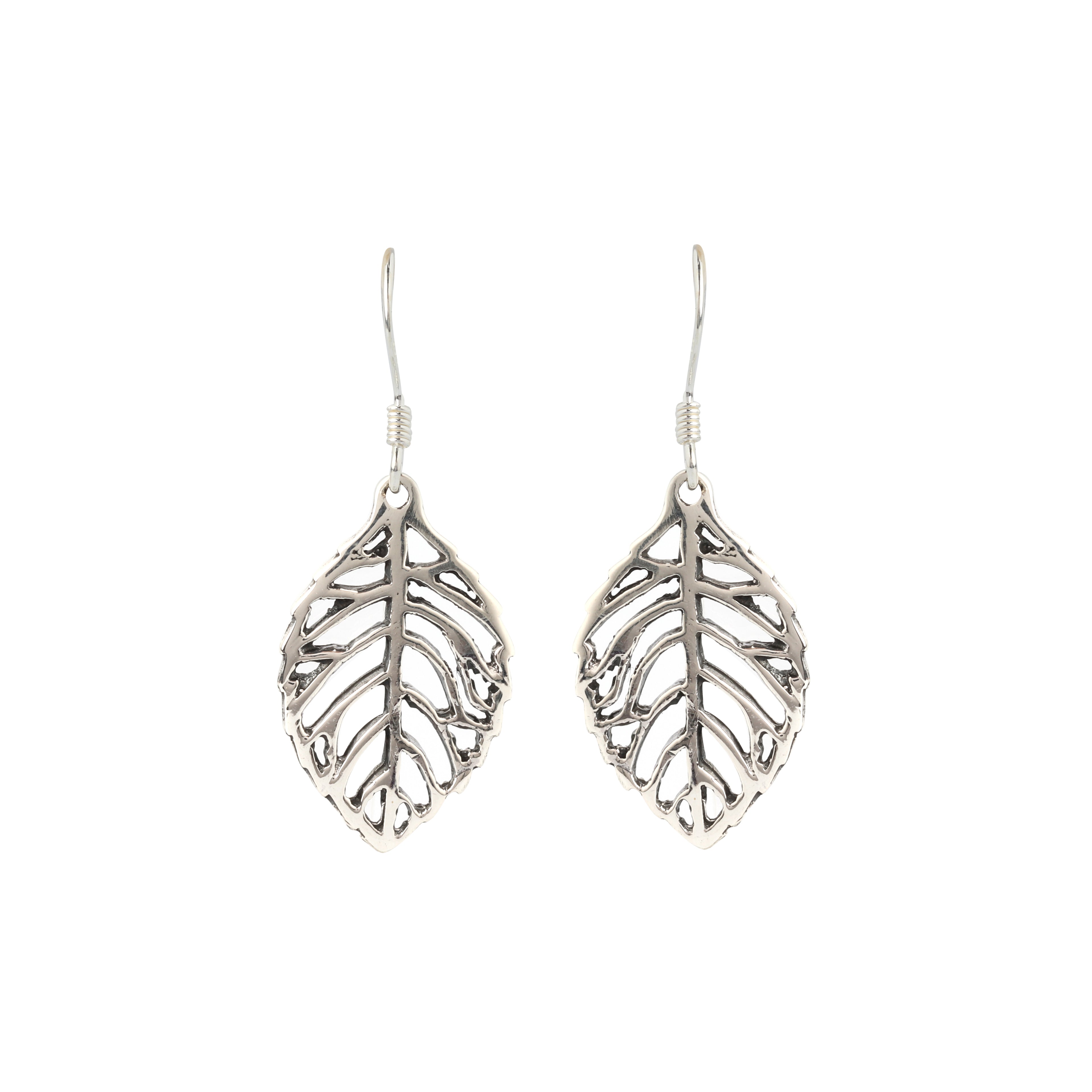 Close-up of leaf-shaped 925 sterling silver drop earrings with openwork veins by Jewelry by Crimson
