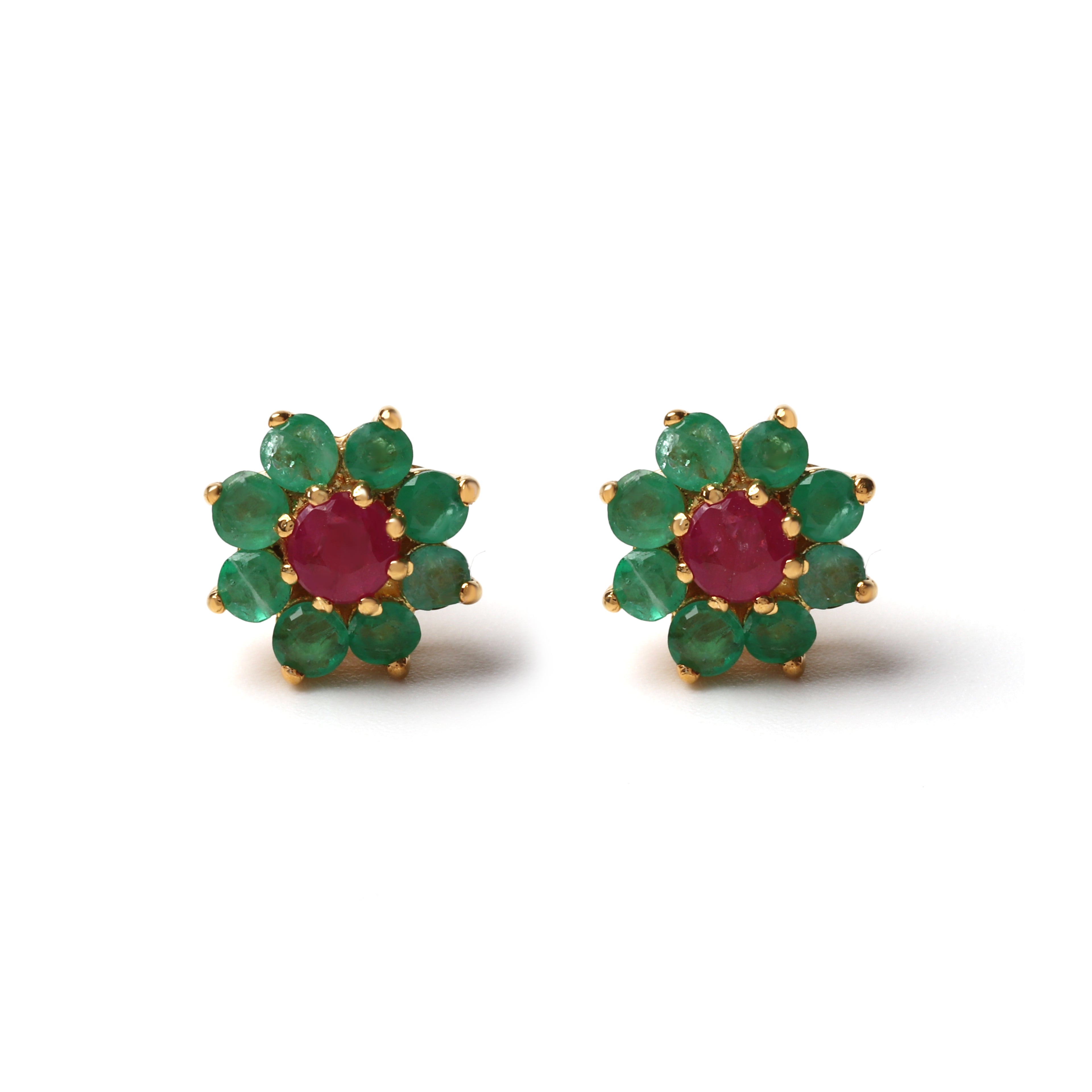 Close-up of 925 sterling silver stud earrings with ruby center and emerald halo, gold finish by Jewelry by Crimson