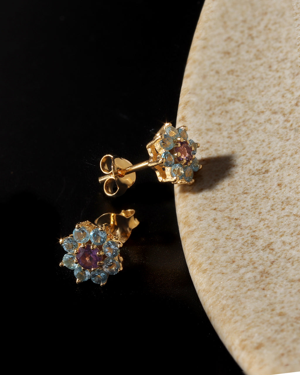 Petite amethyst blue topaz gemstone studs in gold — pair view