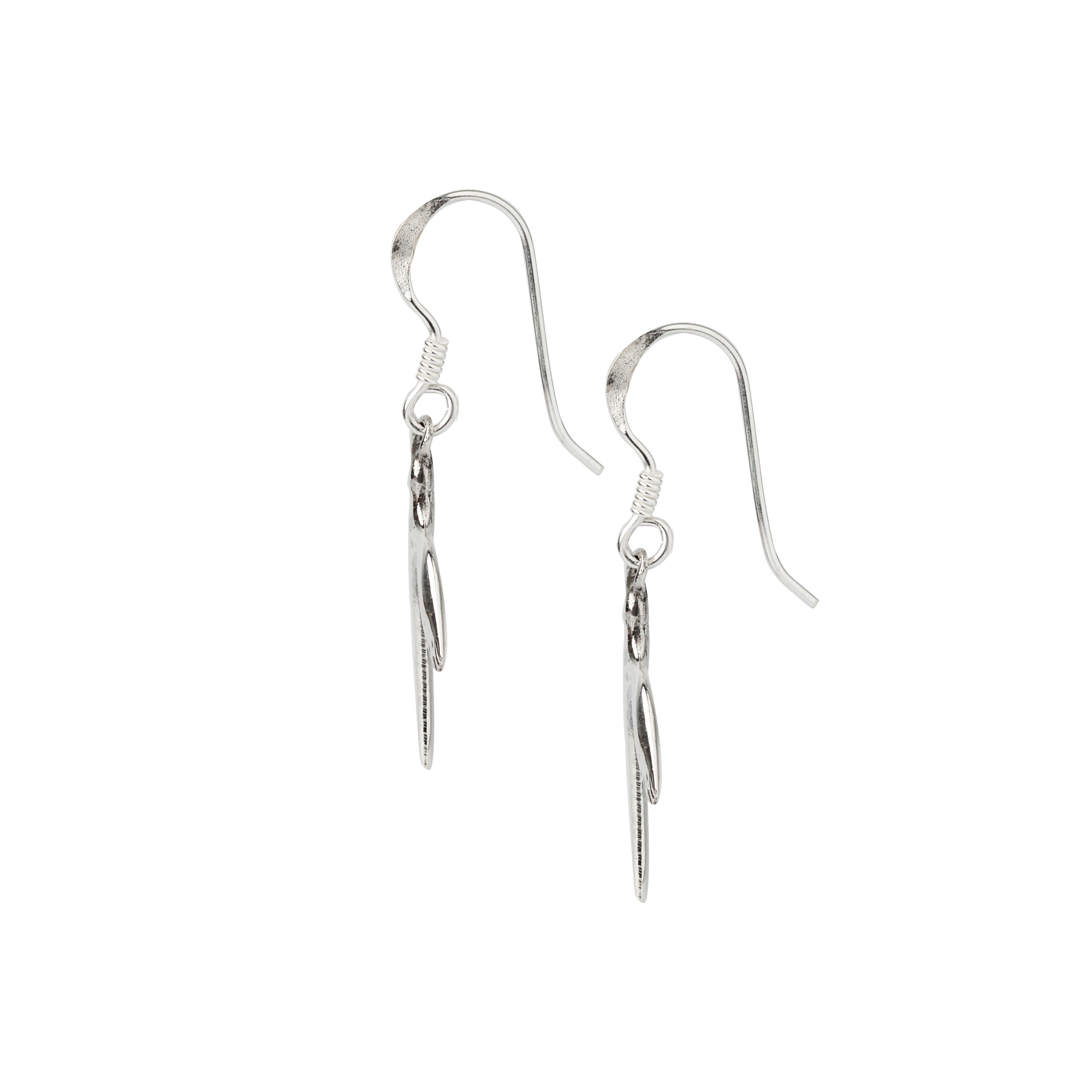 Close-up of sterling silver bird earrings highlighting engraved wing texture and smooth hooks