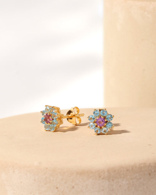 Purple amethyst center with blue topaz petals — flower studs side view
