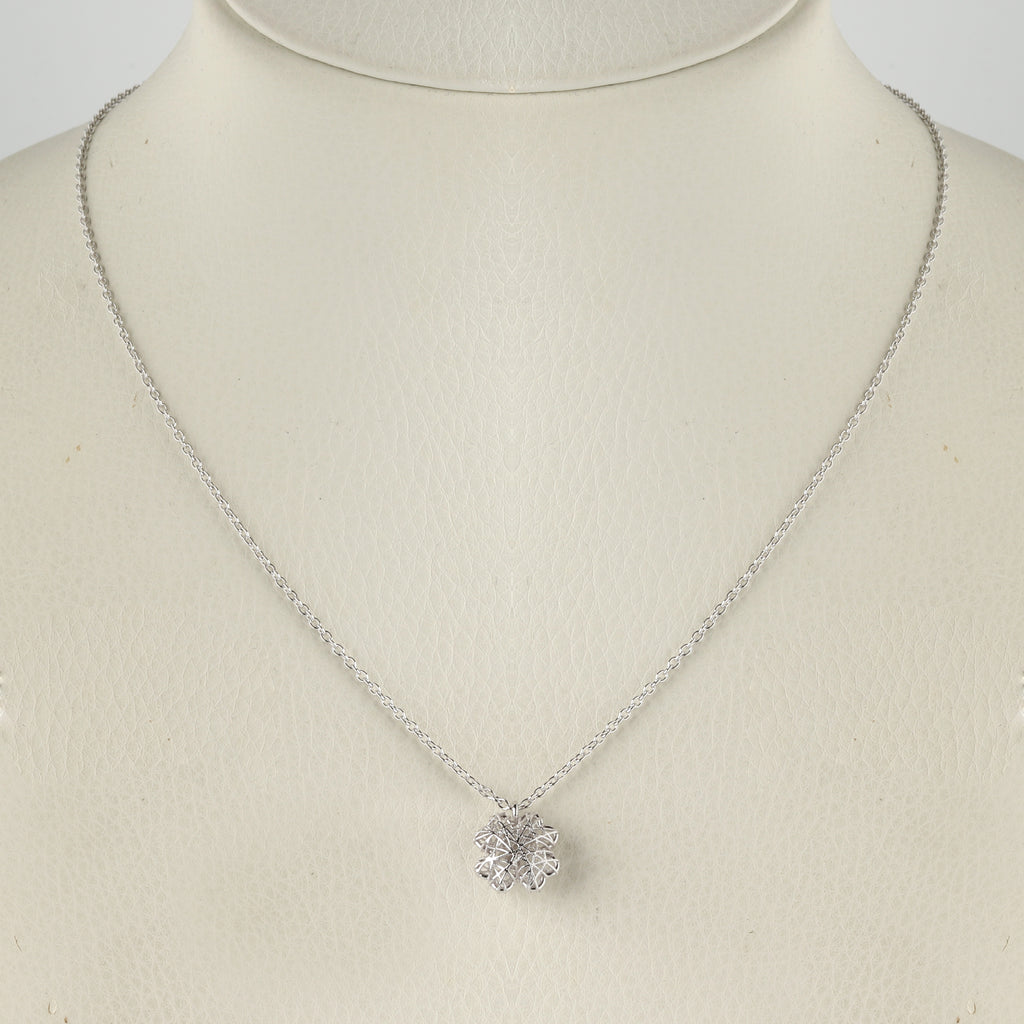 Close-up of 925 sterling silver floral pendant necklace with openwork design by Jewelry by Crimson