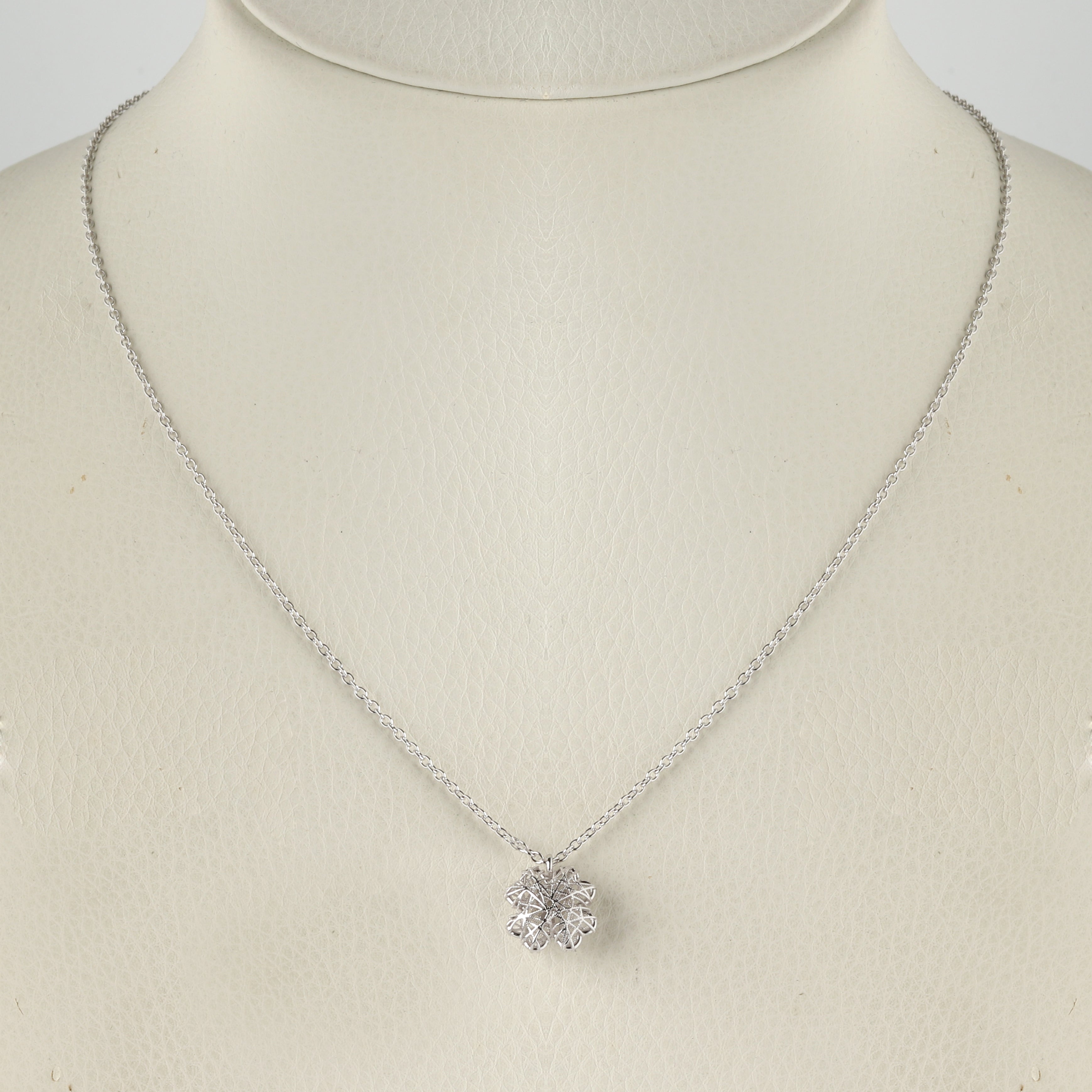 Close-up of 925 sterling silver floral pendant necklace with openwork design by Jewelry by Crimson