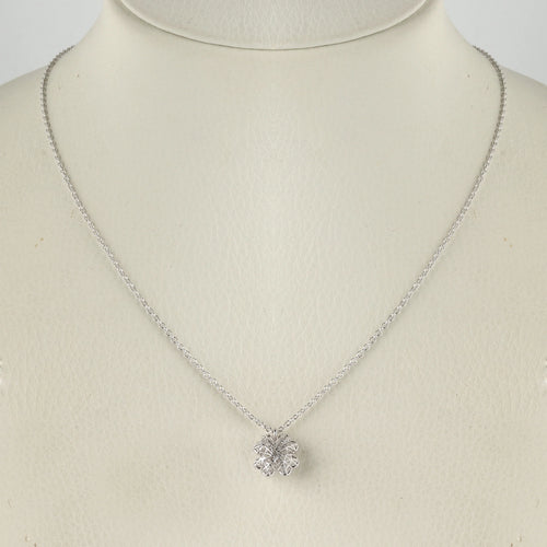 Sterling silver necklace with intricate floral pendant on display mannequin