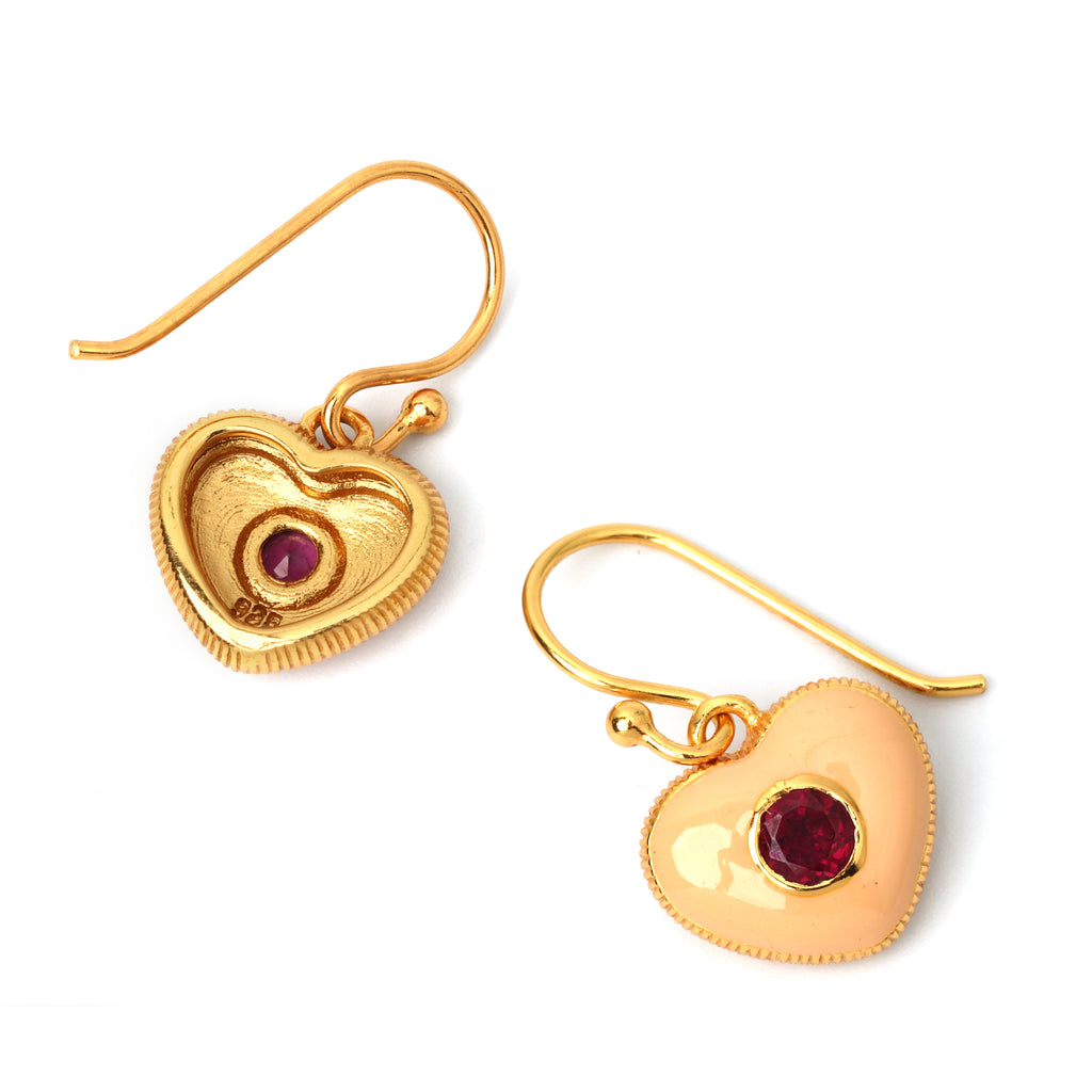 Romantic ruby gemstone earrings with cream enamel heart design
