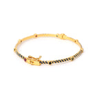 Emerald ruby sapphire bracelet with blue enamel detailing
