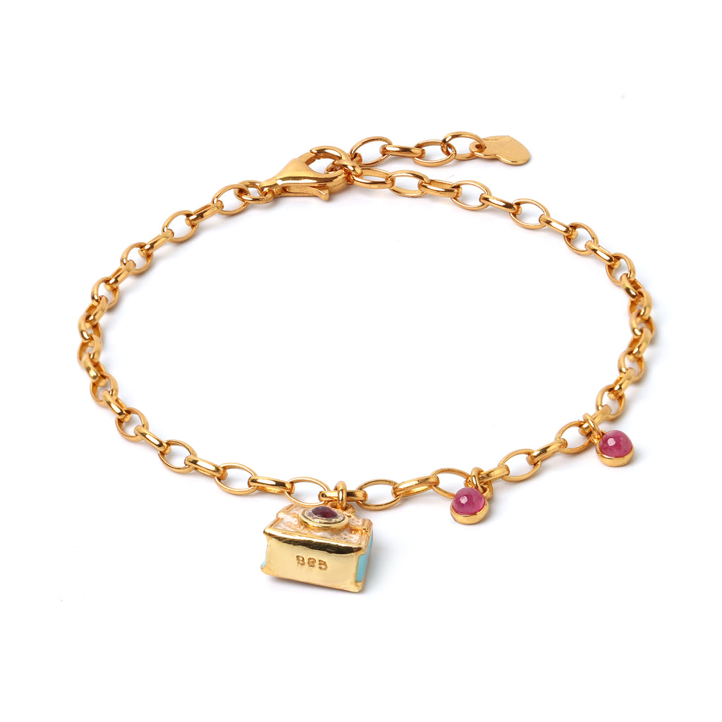 Gold plated ruby charm bracelet in 925 sterling silver with delicate chain design