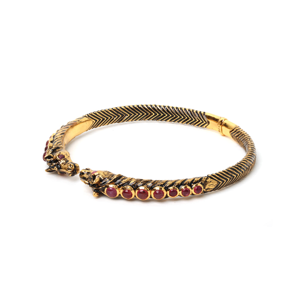 Luxury ruby cuff bracelet with horse motif design