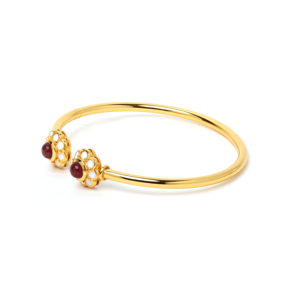 Elegant ruby bracelet with white enamel flower details