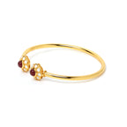 Elegant ruby bracelet with white enamel flower details