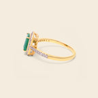 Natural emerald engagement ring in gold — side view