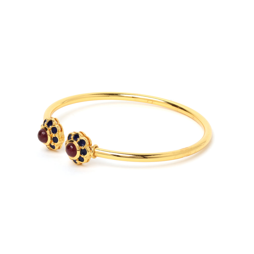 Gold plated ruby bracelet with blue enamel flower accents