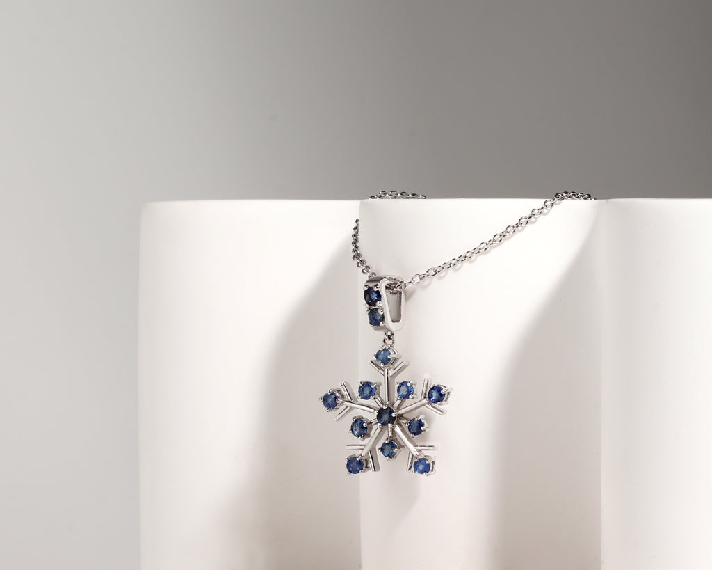 Natural blue sapphire snowflake necklace charm handcrafted in Bangkok