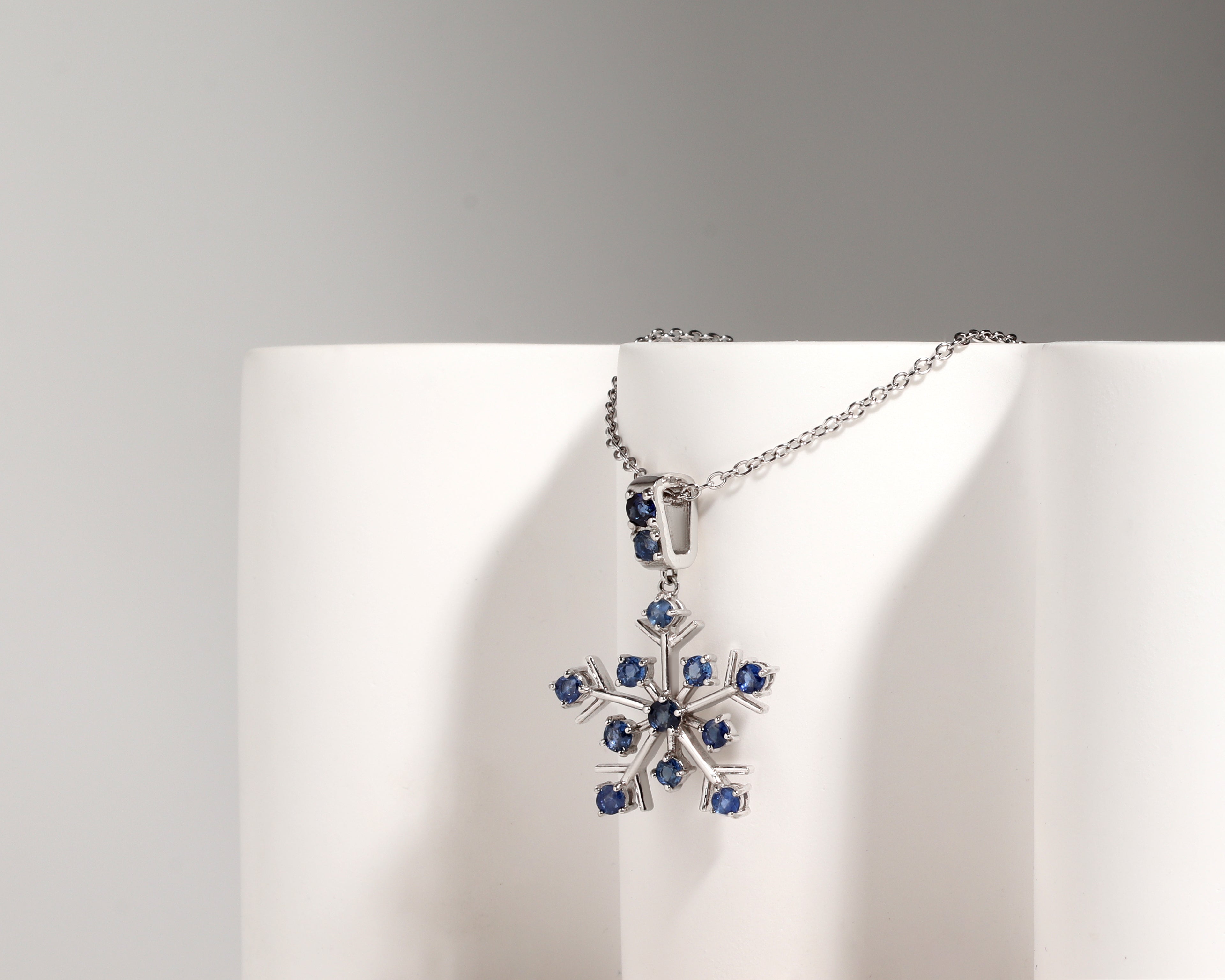 Natural blue sapphire snowflake necklace charm handcrafted in Bangkok