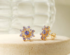 Blue-violet tanzanite snowflake earrings in gold — side view