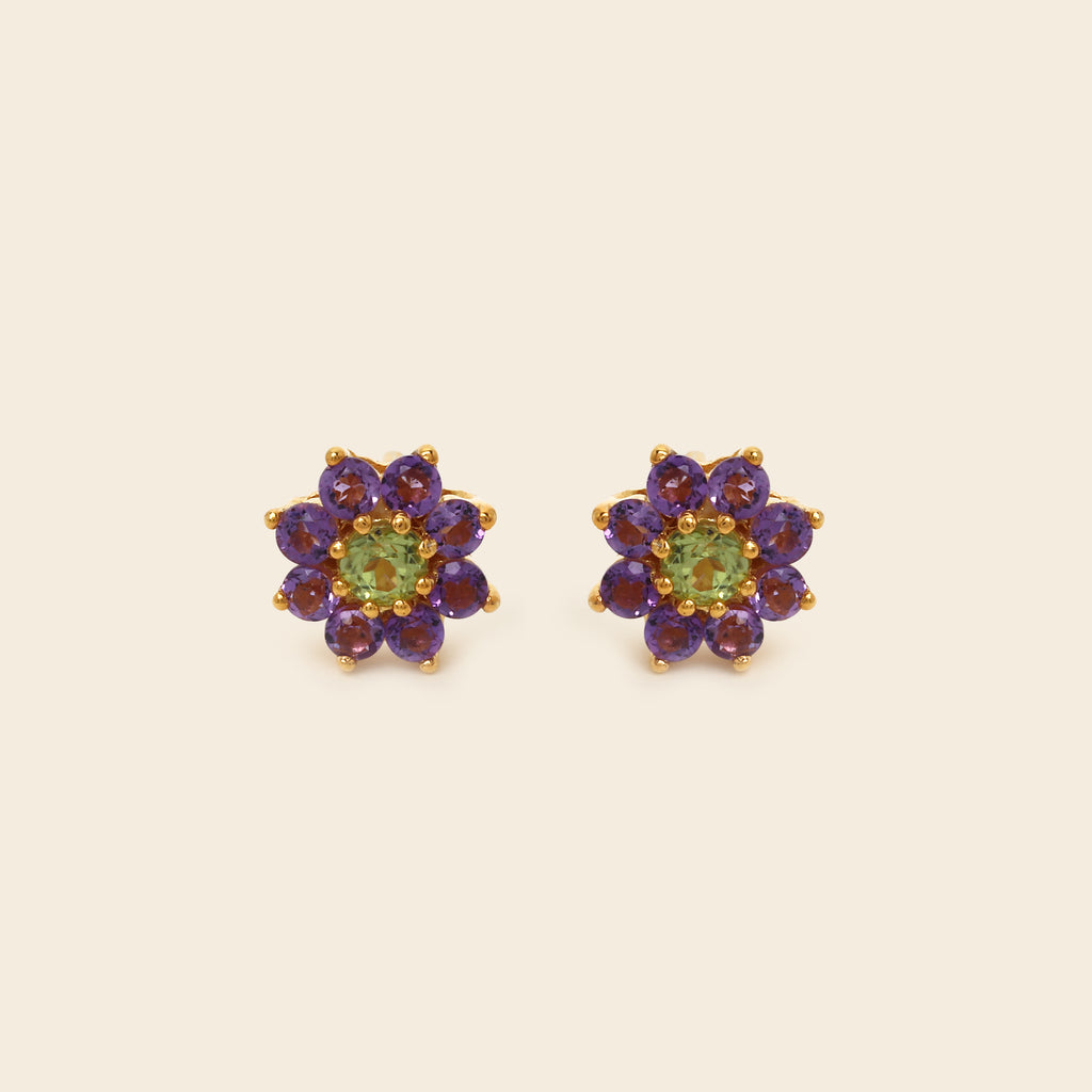Pair of diamond stud earrings on a white background