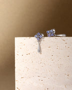 Tanzanite dangle drop earrings in polished sterling silver — detail view