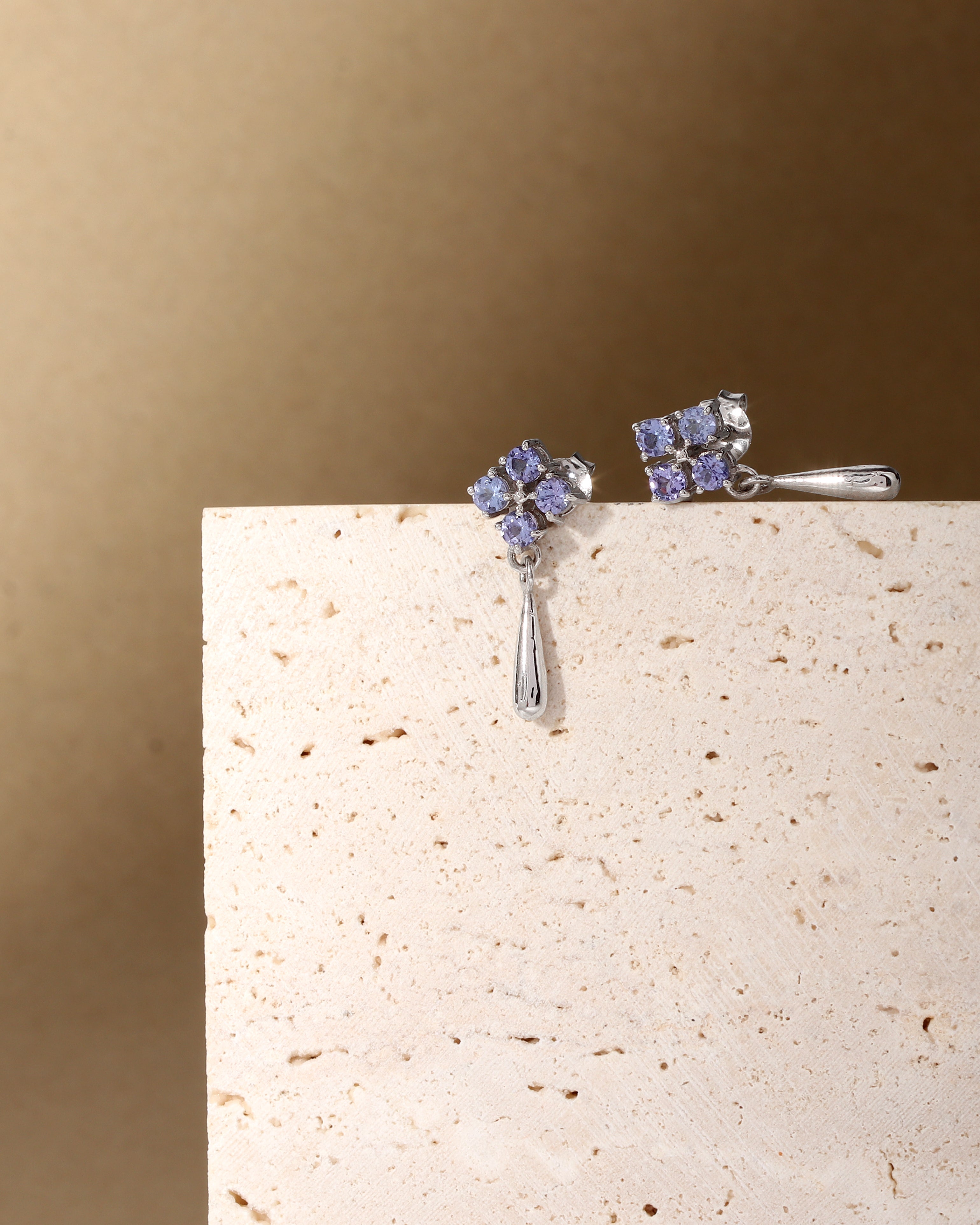 Tanzanite dangle drop earrings in polished sterling silver — detail view