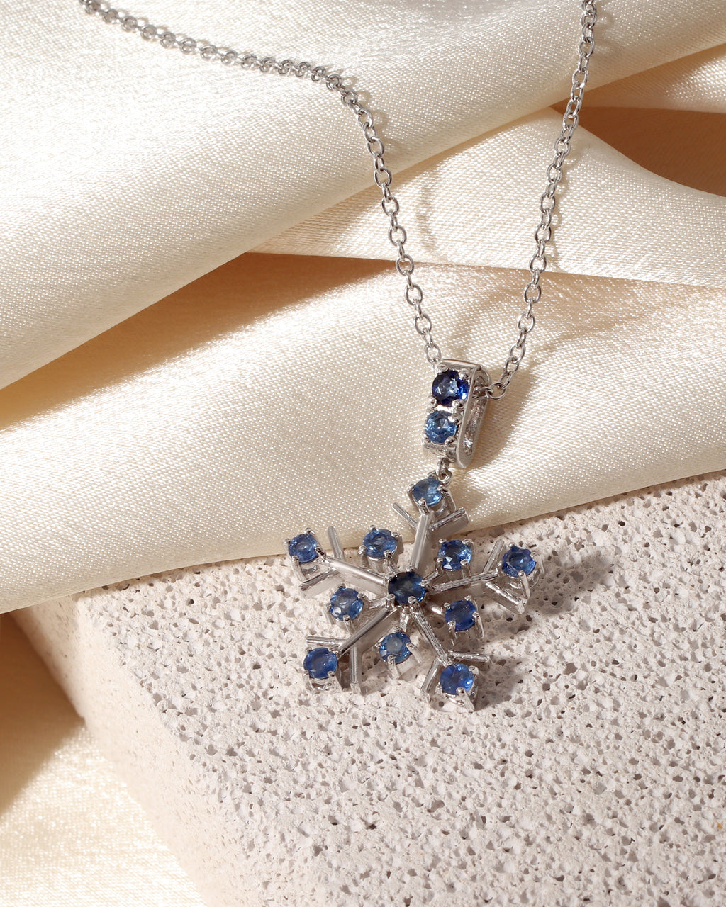 September birthstone sapphire snowflake pendant