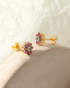 Petite blue topaz amethyst gemstone studs in gold — pair view