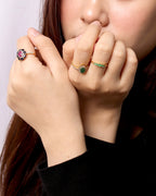 Octagon-cut emerald engagement ring in gold — front view