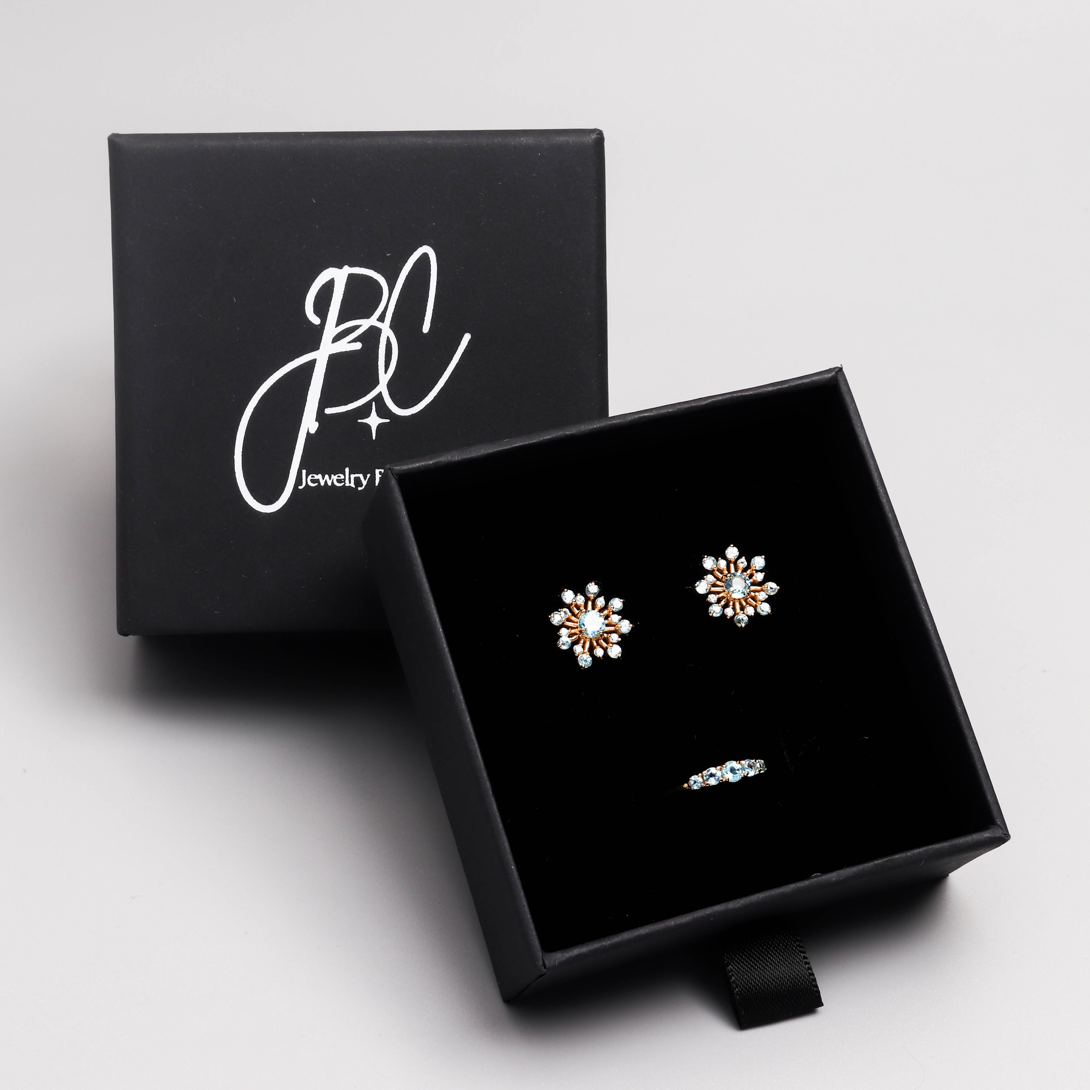Blue Topaz Snowflake Stud Earrings in 18K Gold