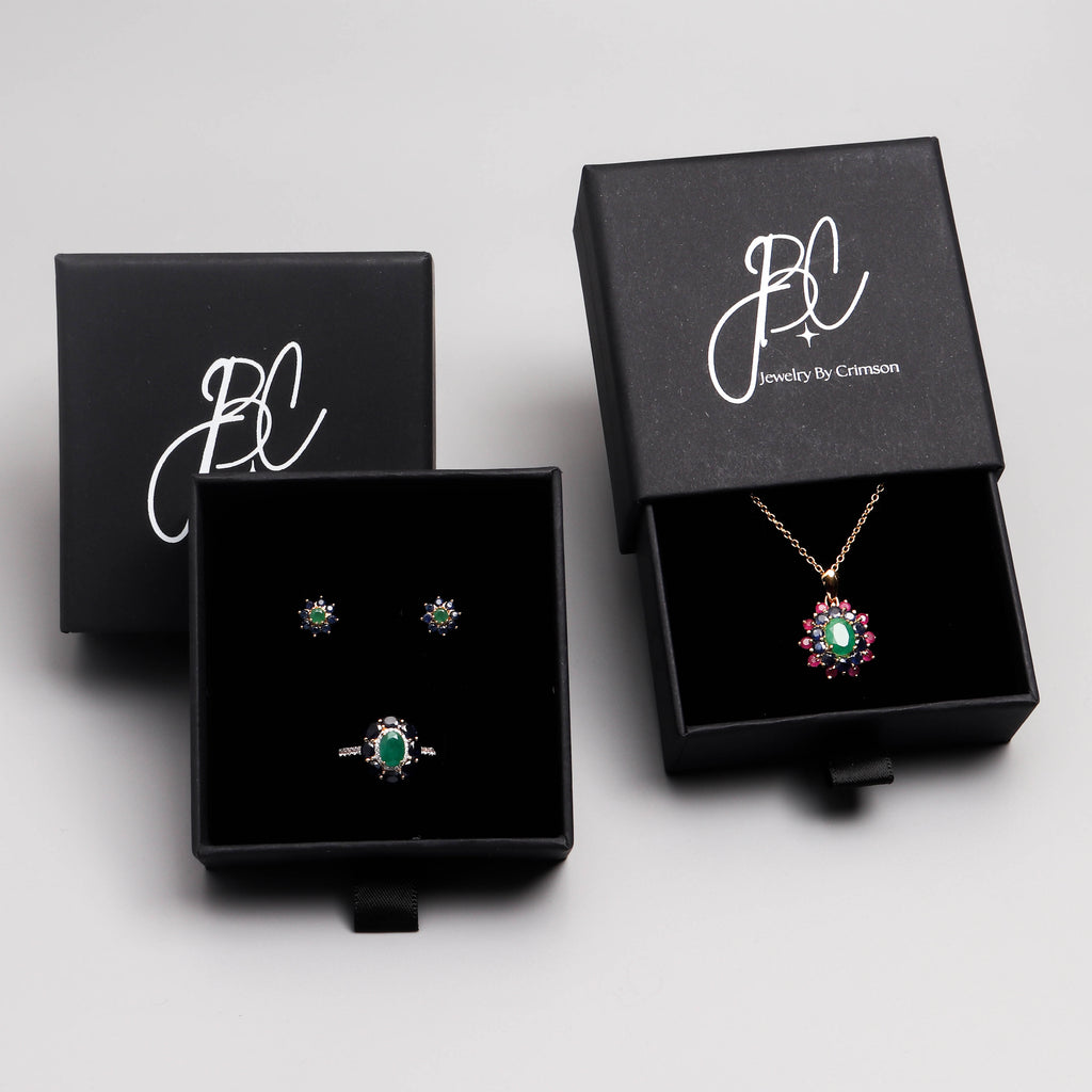 Emerald sapphire and ruby flower pendant in 18K gold — display view