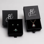 Emerald sapphire and ruby flower pendant in 18K gold — display view