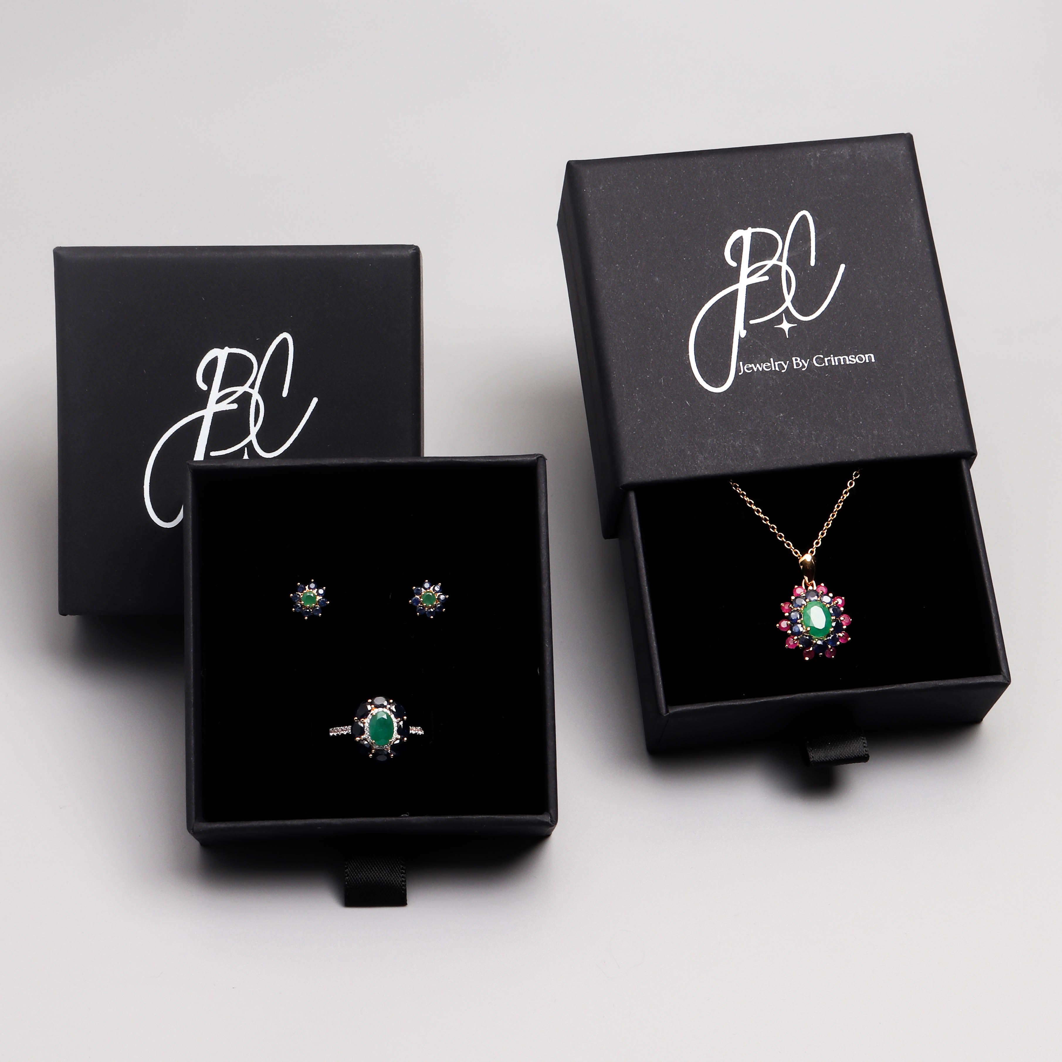 Emerald sapphire and ruby flower pendant in 18K gold — display view
