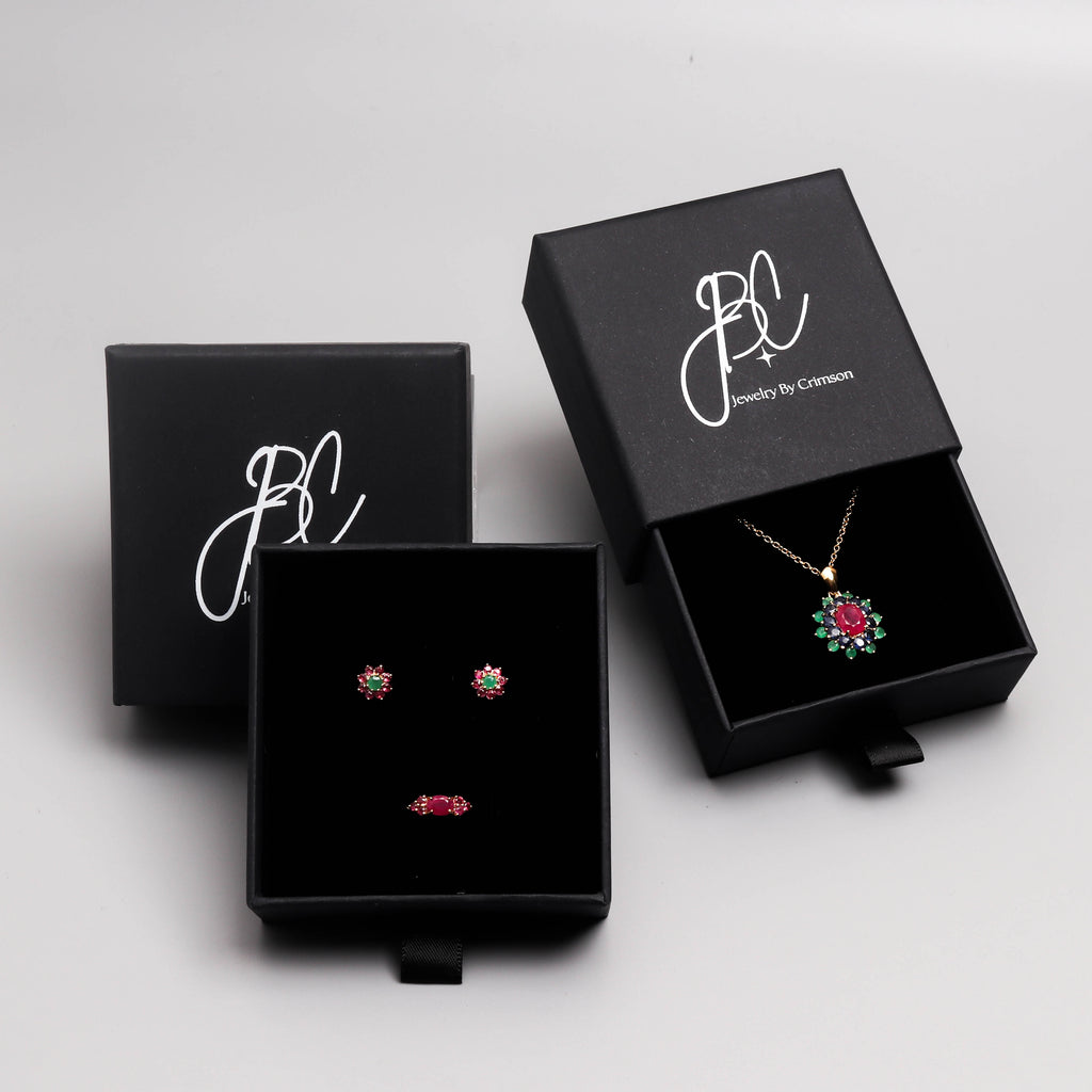 Ruby sapphire and emerald flower pendant in 18K gold — display view