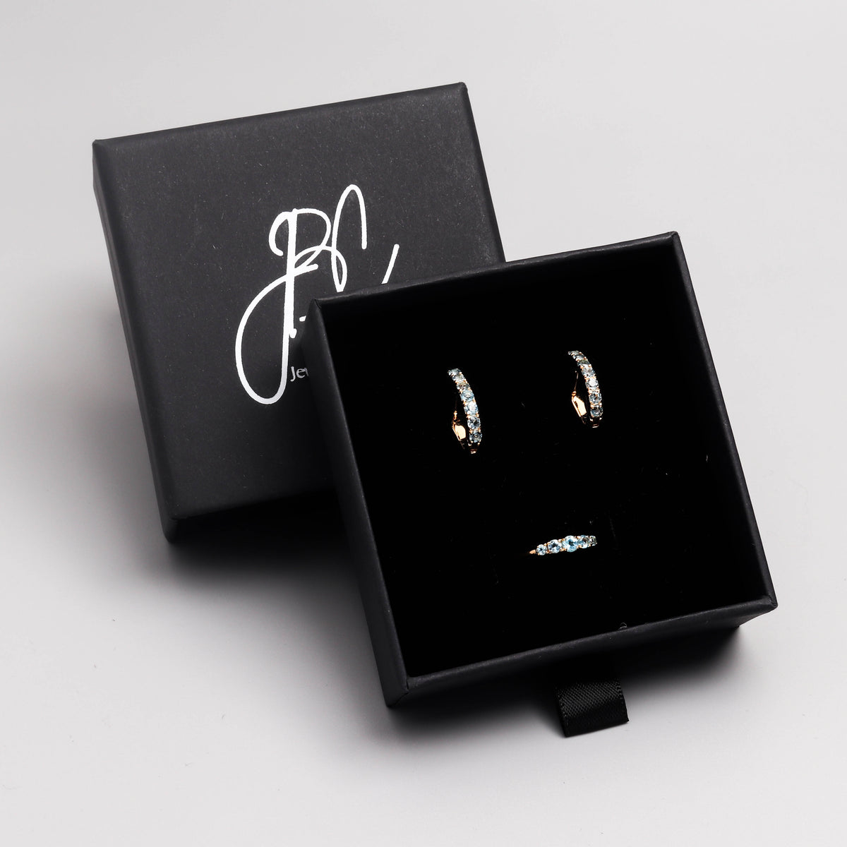 Blue Topaz Huggie Hoop Earrings in 18K Gold