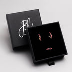Pink tourmaline huggie hoop earrings in 18K gold — display view