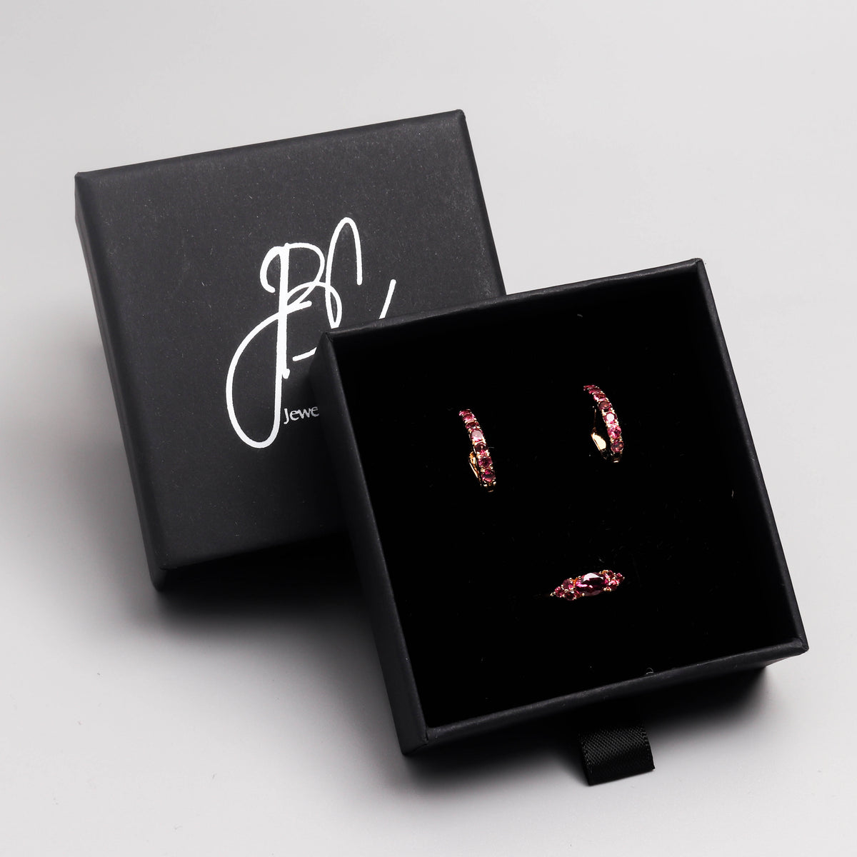 Pink tourmaline huggie hoop earrings in 18K gold — display view